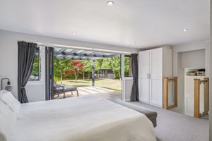 Main bedroom and doors to garden- click for photo gallery